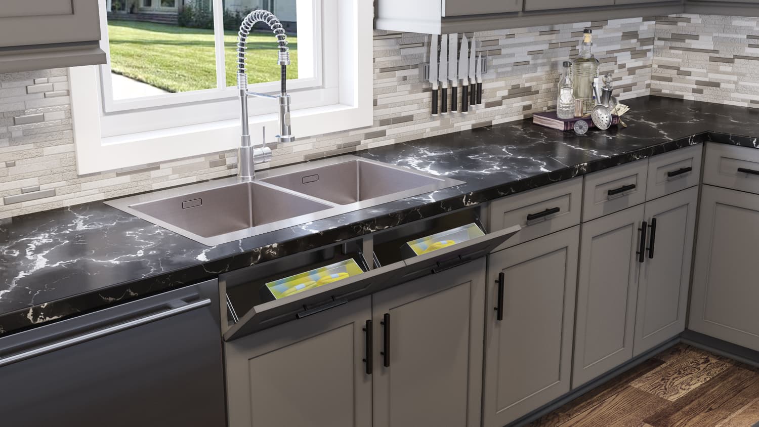 Grey cabinets with black stone sink